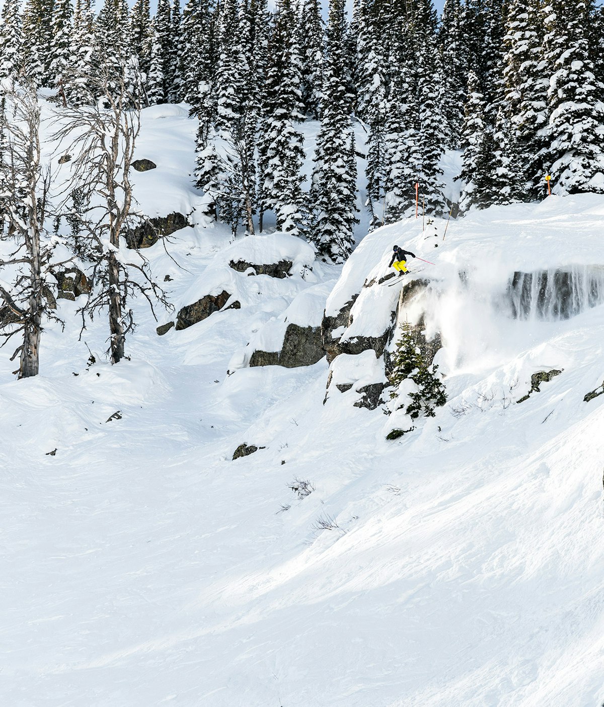 Skier going off a cliff