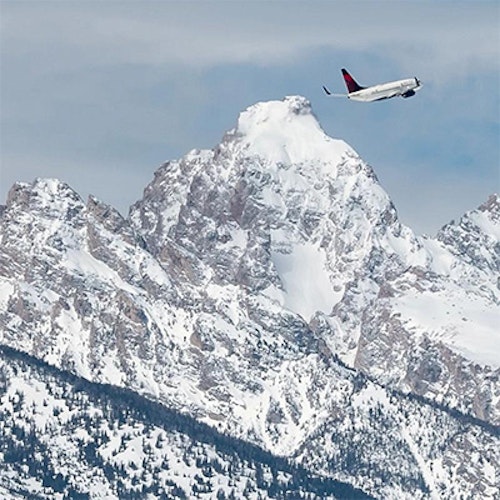 Plane in front of Tetons