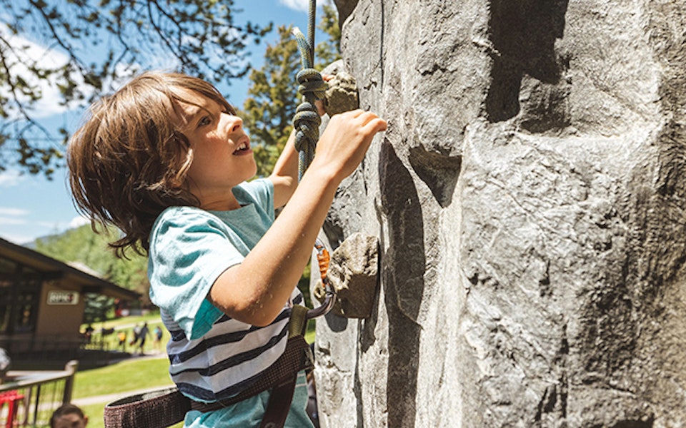 Boy climbing on the climbing wall