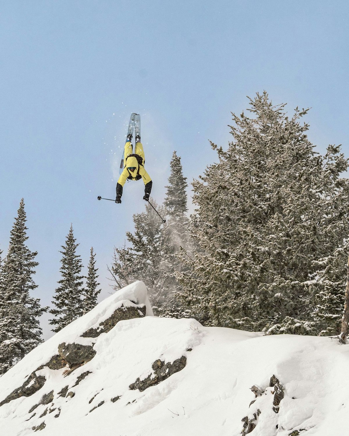 Skier getting inverted off a cliff