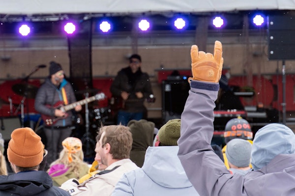 Person giving the "Rock On" hand signal during Road to Rendezvous performance