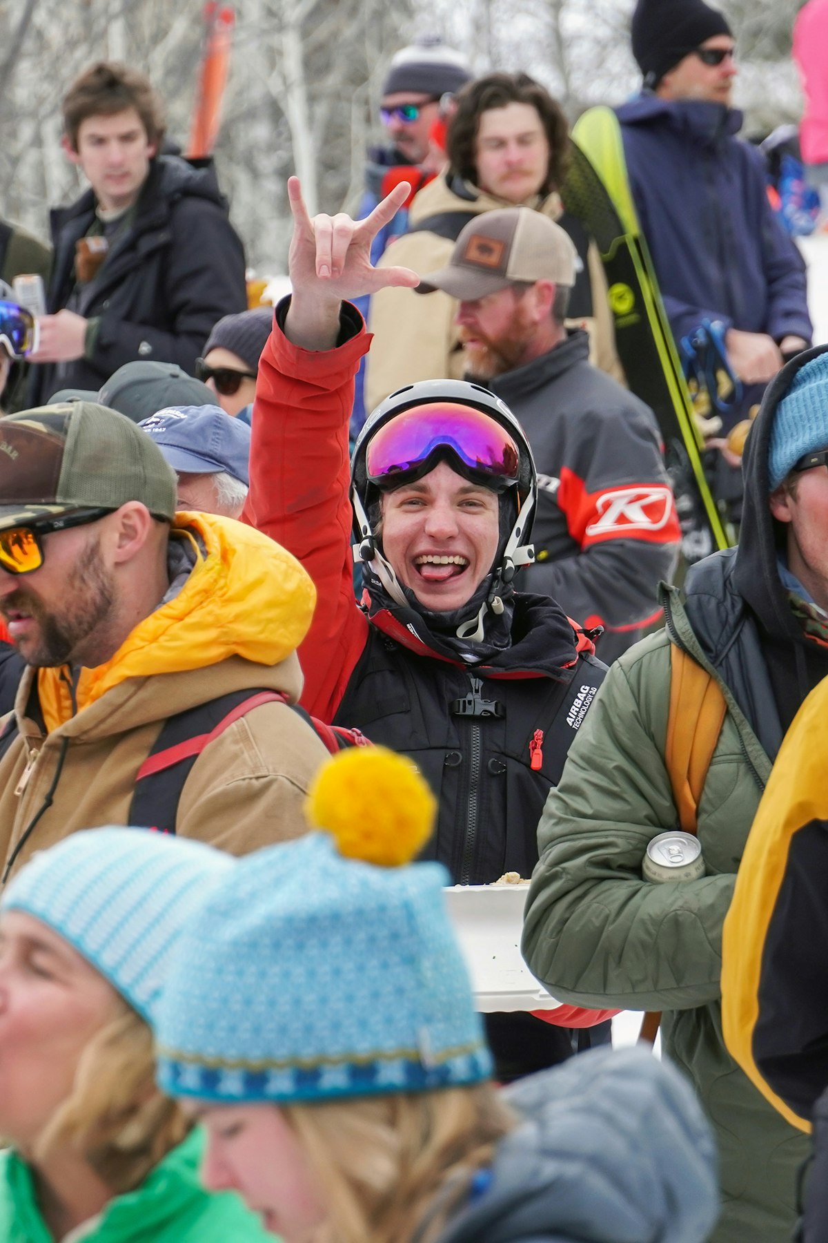 Person giving the "Rock On" hand signal during Road to Rendezvous performance