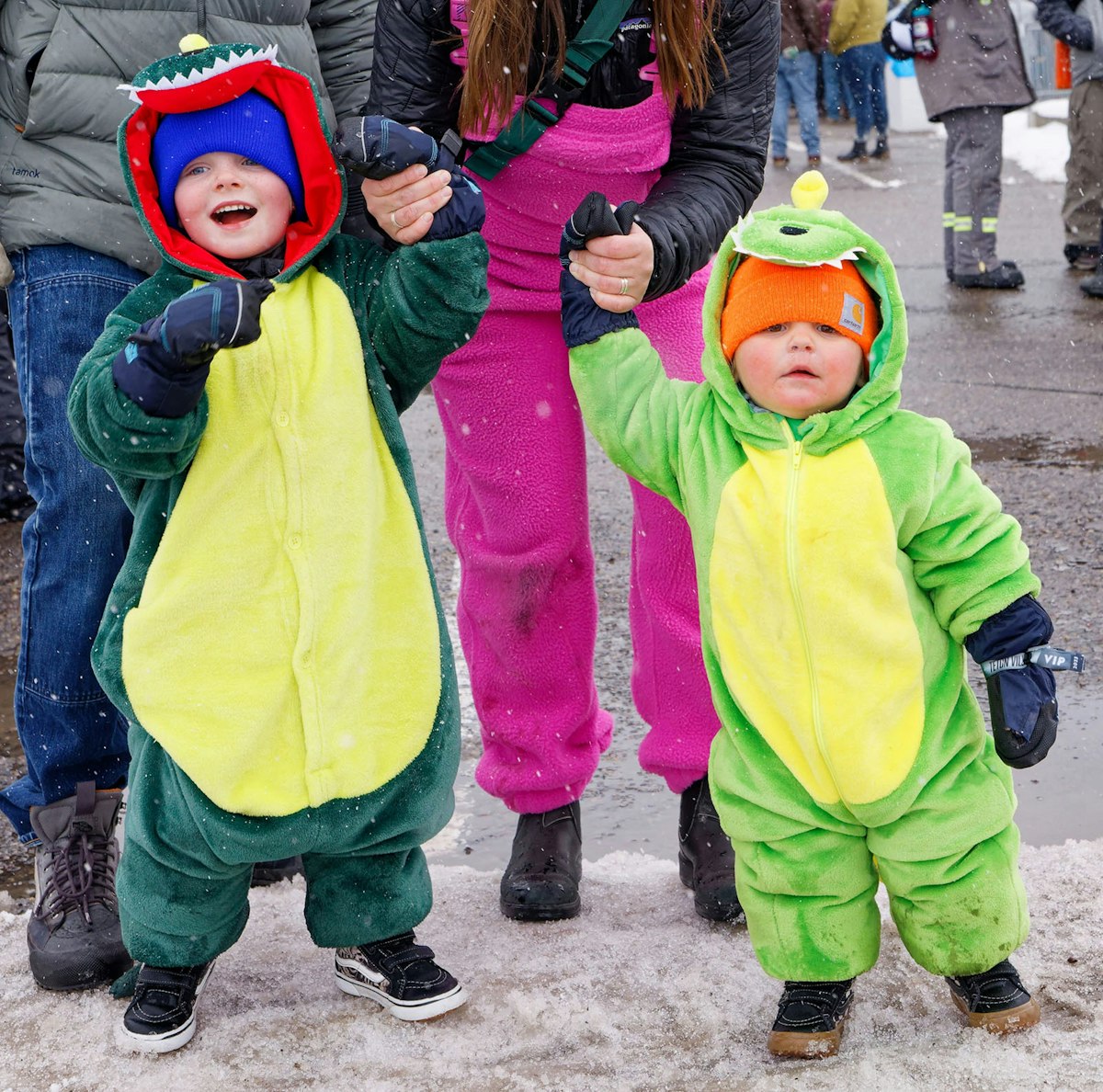Kids dressed in dinosaur onesies at Rendezvous Spring Festival