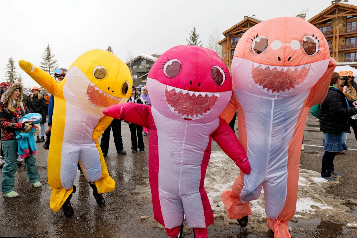 People in inflatable shark costumes at Rendezvous Spring Festival