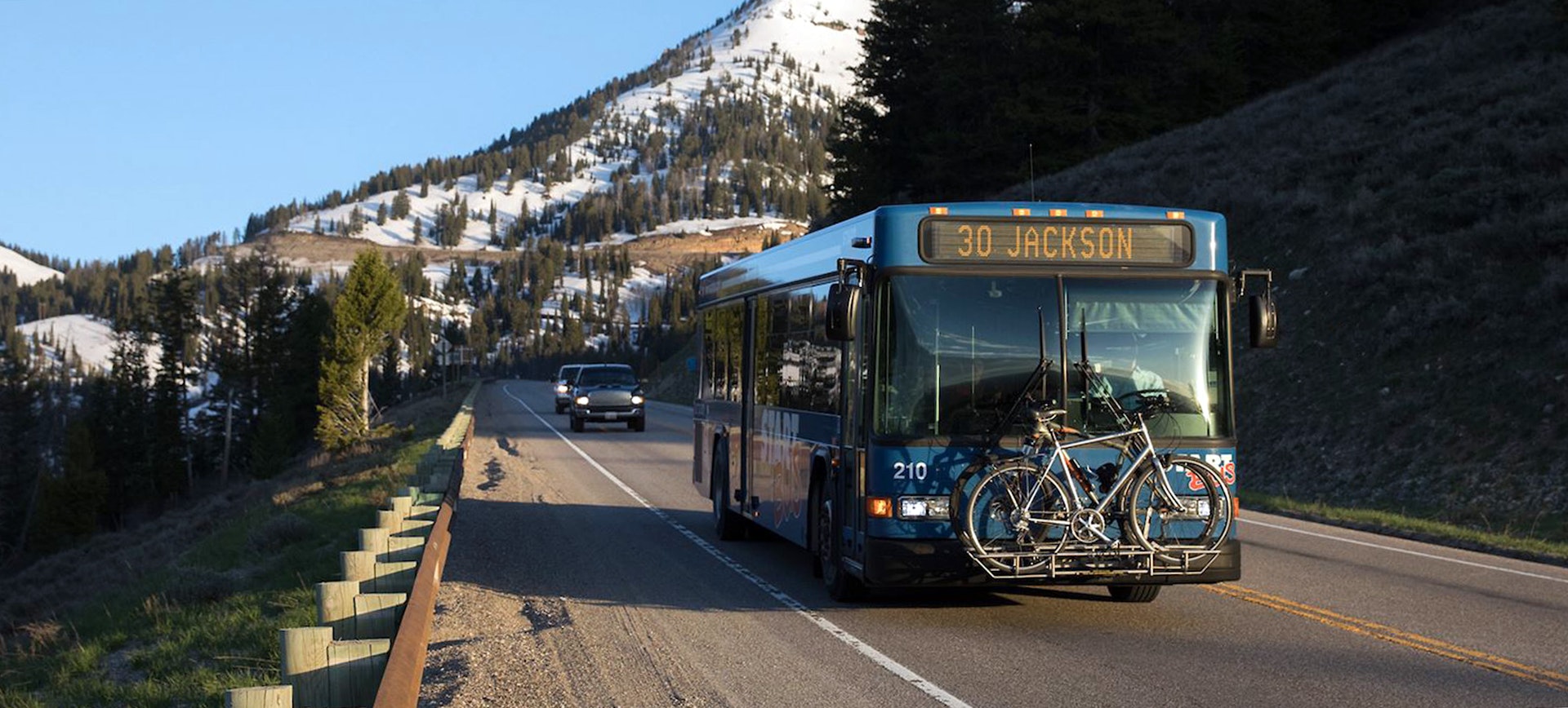 The START Bus with bikes on the front driving on the pass