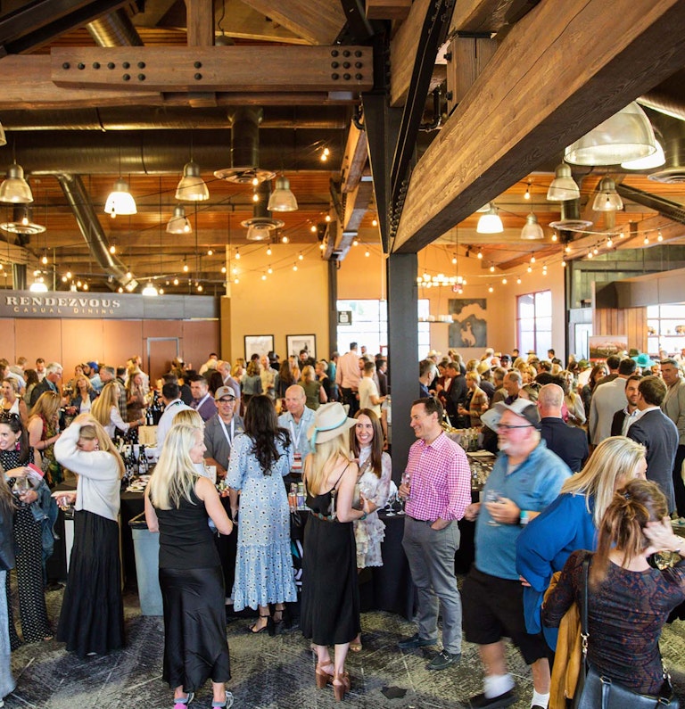 people mingling in Rendezvous Lodge at Taste of Jackson Hole
