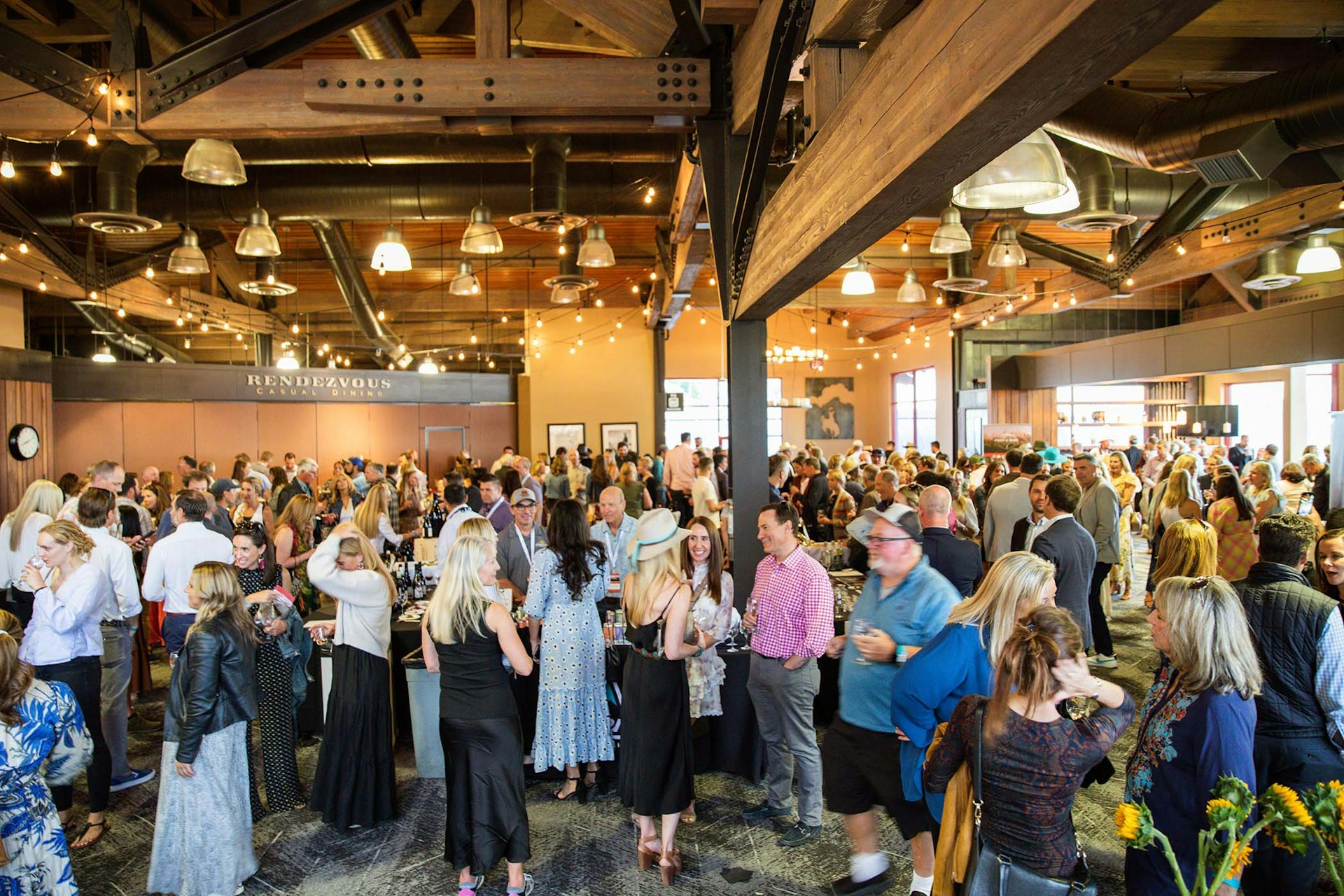 people mingling in Rendezvous Lodge at Taste of Jackson Hole