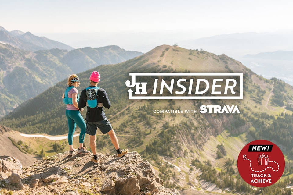 Two people hiking with JH Insider compatible with Strava logo overlaid and new tracking
