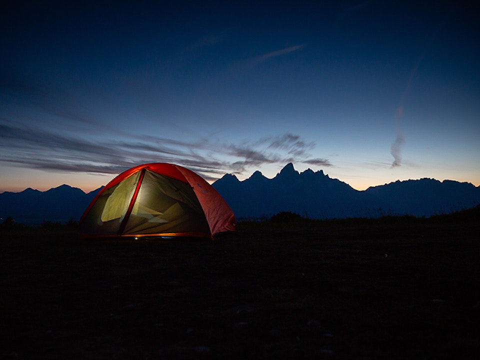 Camping with a view of the Teton Mountain Range at sunset