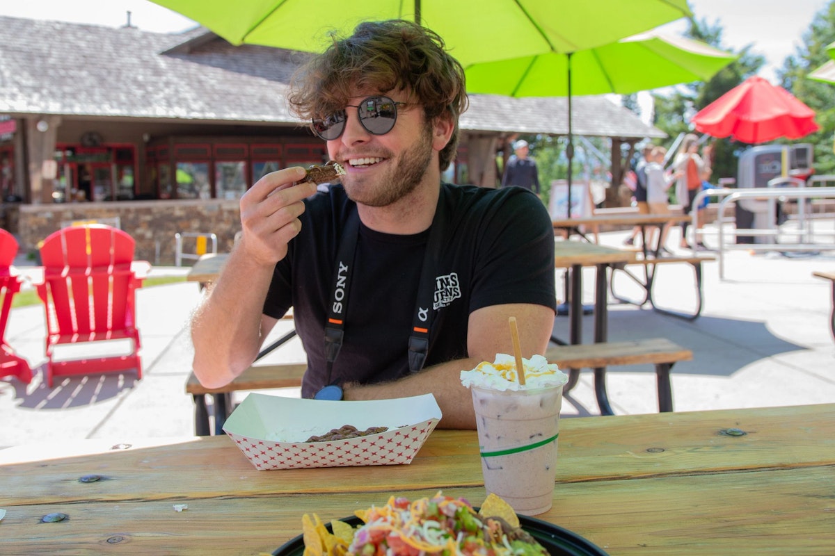 Person eating churros from Tin Can Cantina