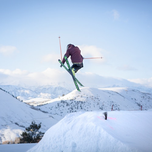 Skier going off a jump at Snow King. Credit: New Thought Media