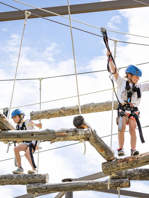 Kids on the ropes course at Grand Adventure Camp
