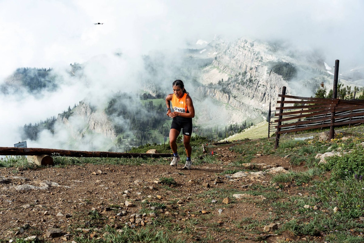 A woman running up the Rendevous Mountain Hillclimb course