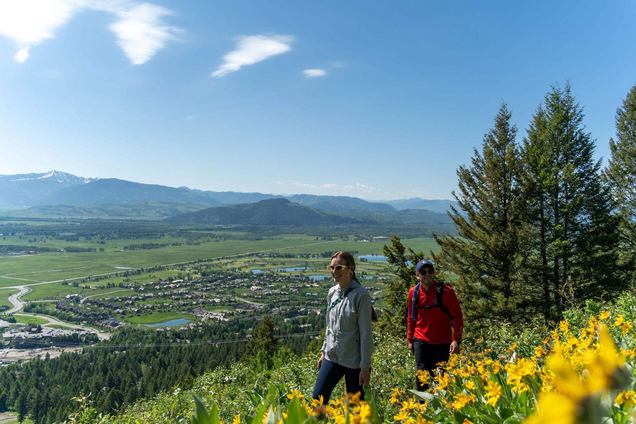 two people hiking up the wildflower trail