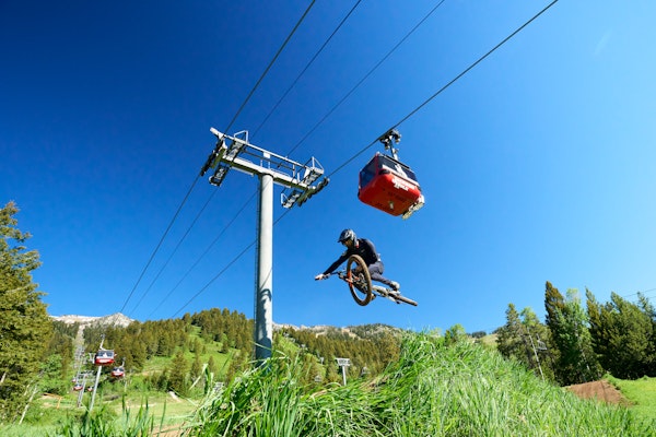 getting air in the bike park with the gondola flying above