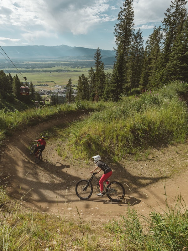 Three people riding in the bike park