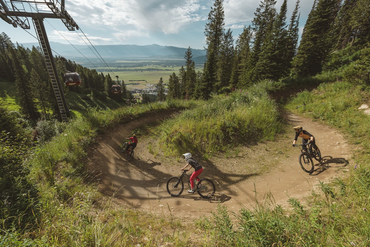 Three people riding in the bike park