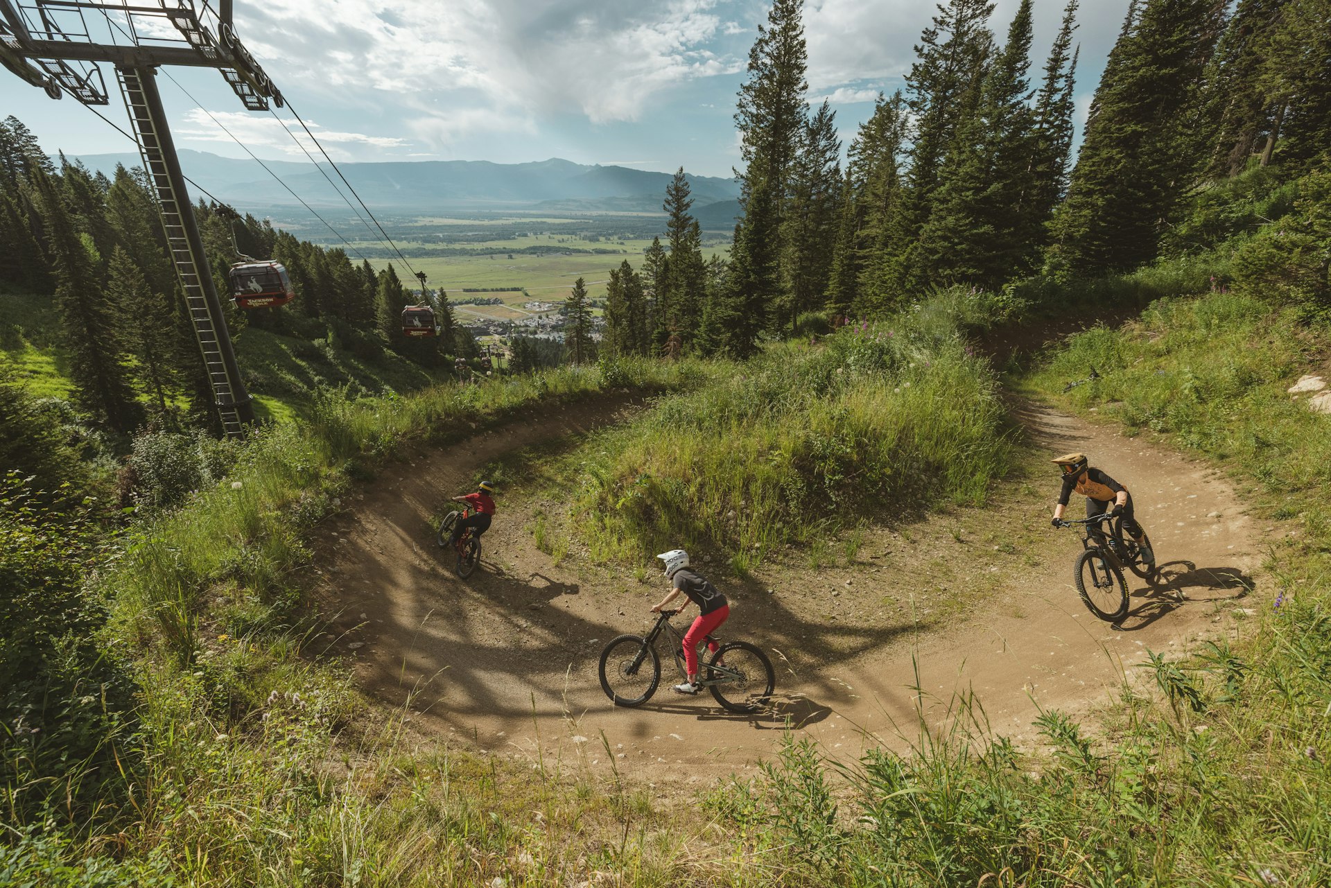 Three people riding in the bike park