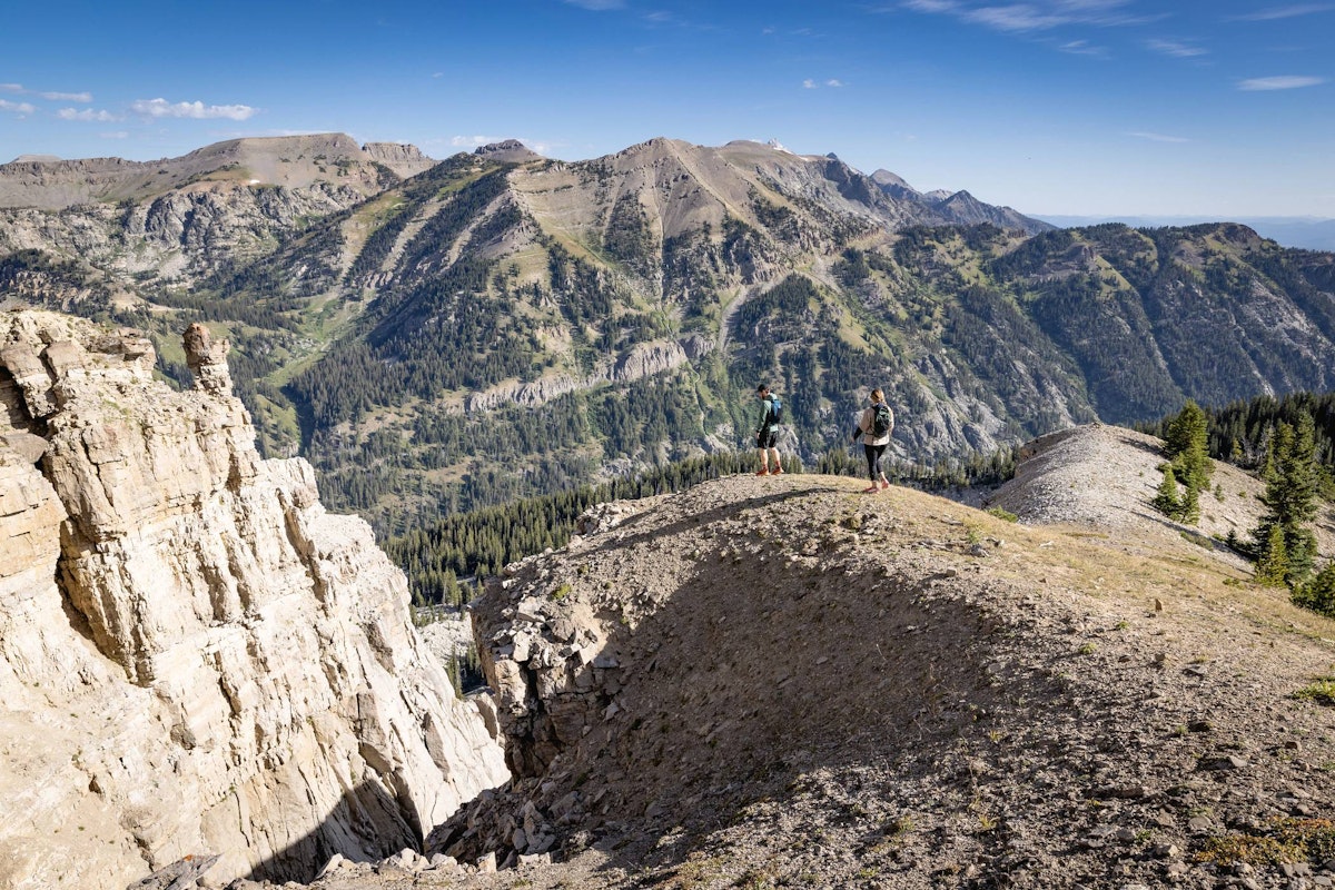 Two hikers on a natural overlook along the North Ridge Trail