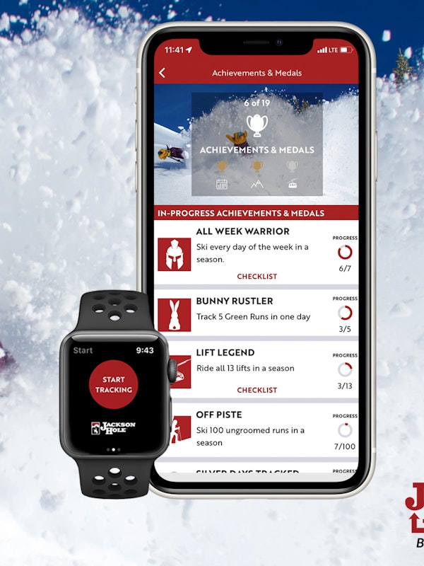 jh insider app on phone over deep powder