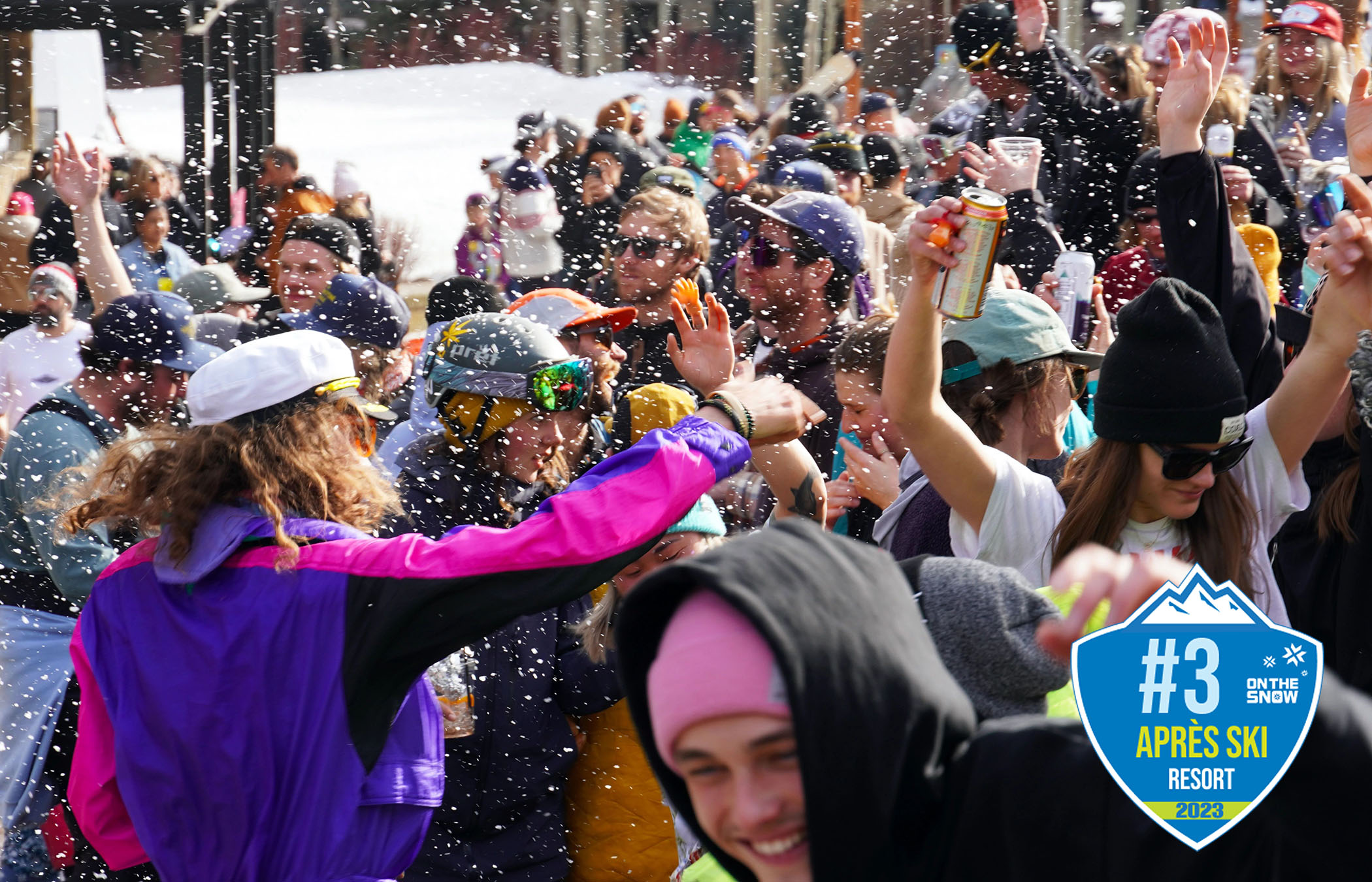 People partying at the base of the mountain with Apres Ski badge