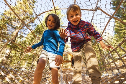 Two boys playing in the Wild Woods Playground