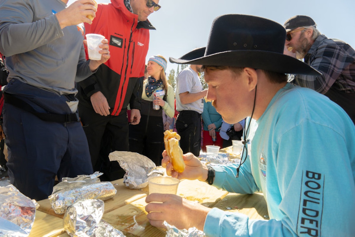 Cowboy eating bear dog