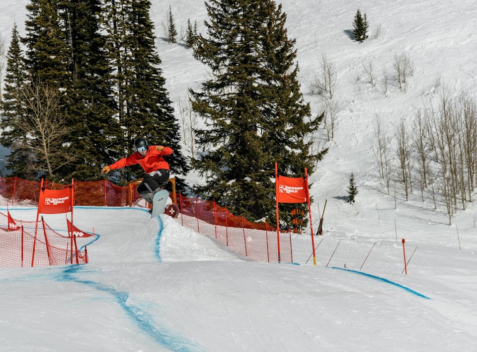 Snowboarder getting air during Dick's Ditch competition