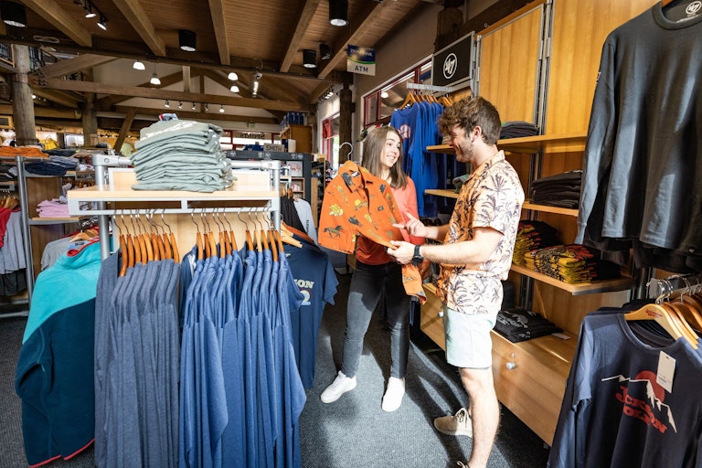 man and woman looking at clothing at JH Sports