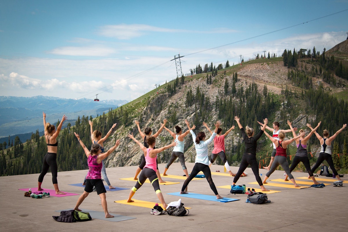 people doing yoga on the deck