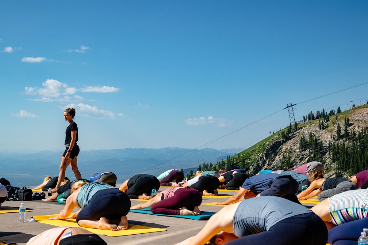 people doing yoga on the deck