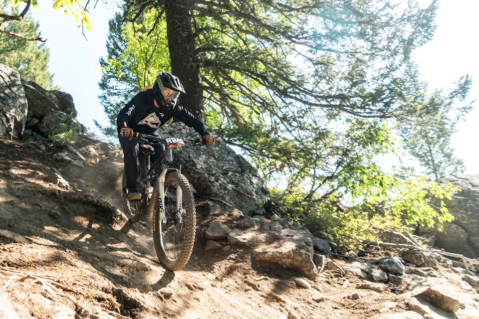 person racing in bike park