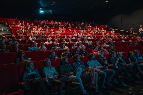 People watching a movie in a theater