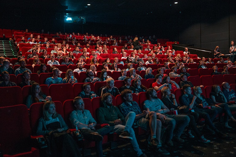 People watching a movie in a theater