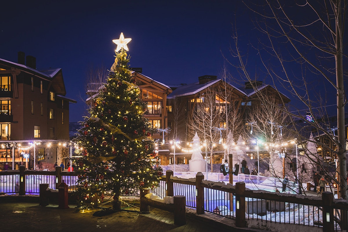 Tree lighting with ice rink background