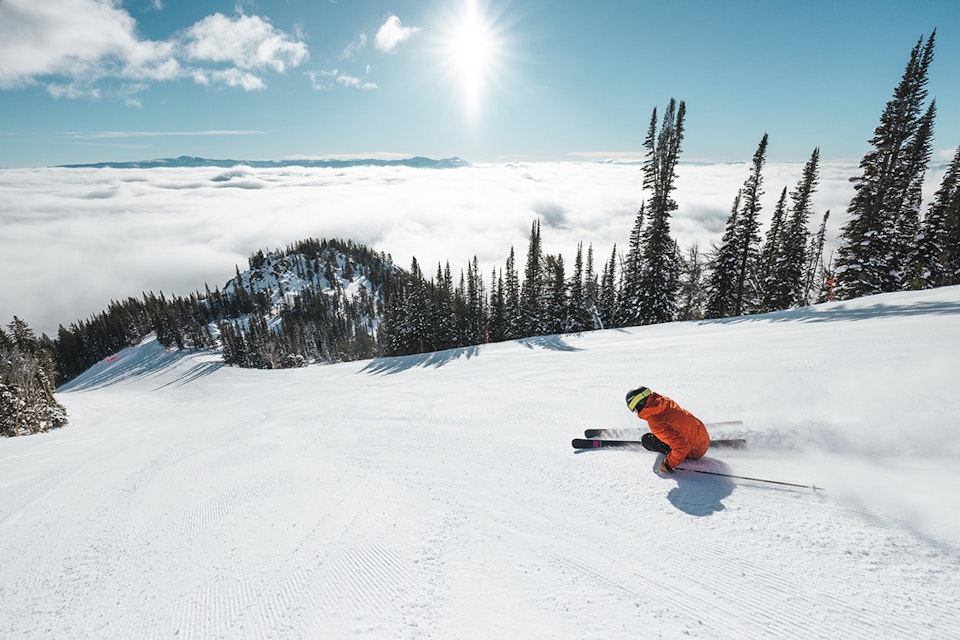 skier on groomer