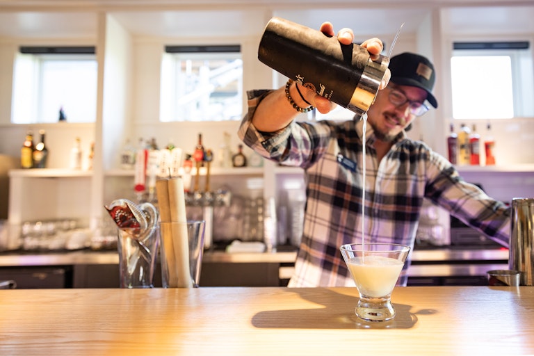 Tram Dock bartender pouring drink