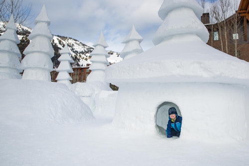 Kid in snow castle