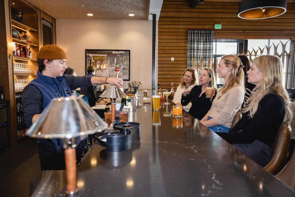 Women siiting at Trapper's bar