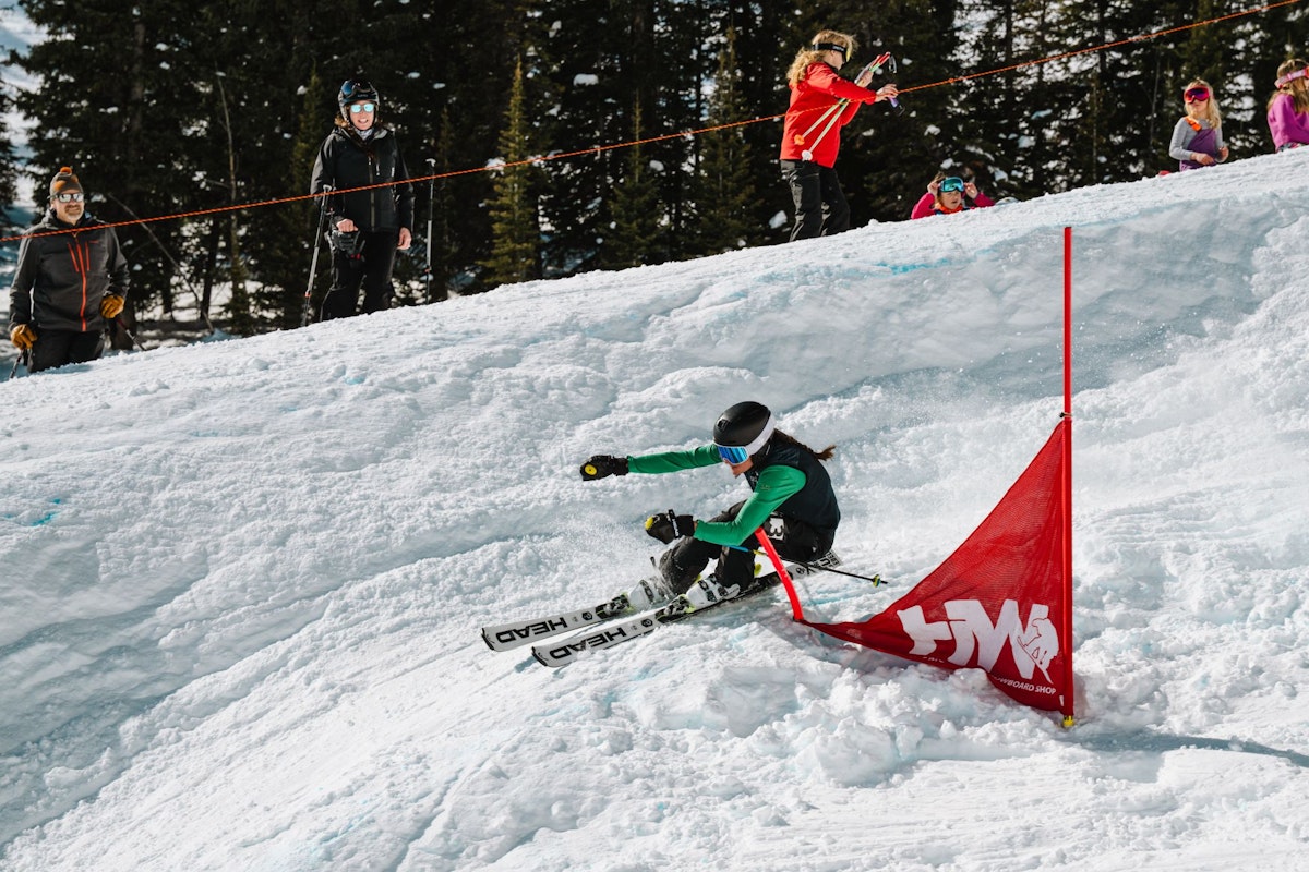 Skiier turning around gate in Dick's Ditch