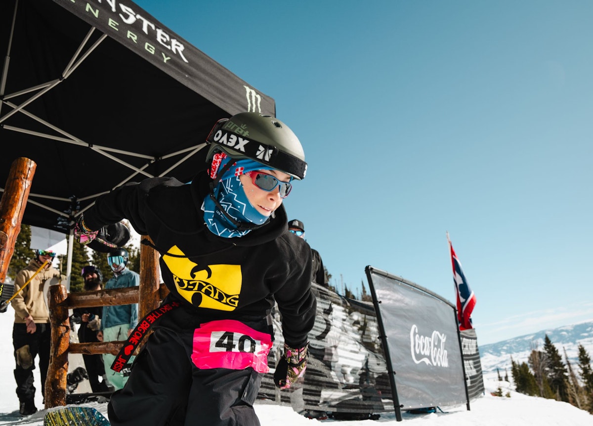 Snowboarder leaving start gate at Dick's Ditch