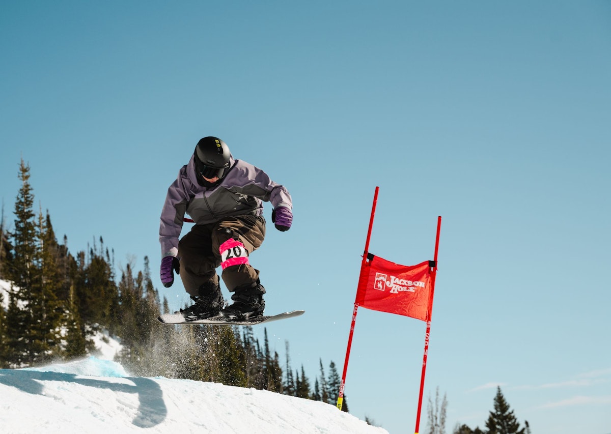 Snowboarder getting air in Dick's Ditch