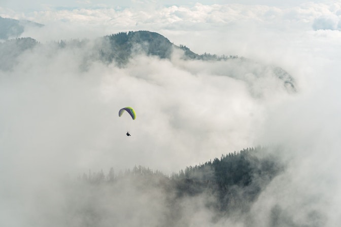 Summer paragliding through mist