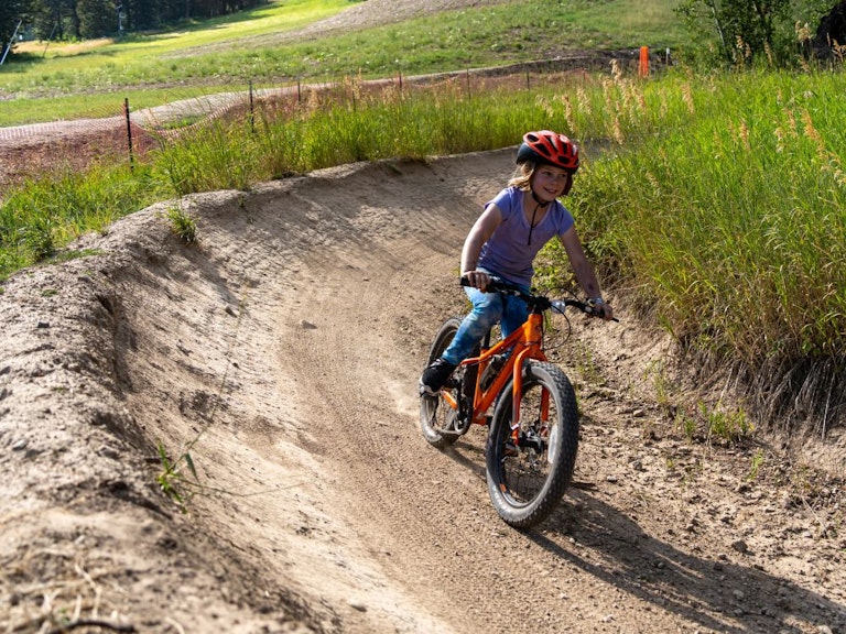 Kid on bike in bike park