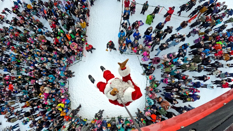 Santa Claus descending from the aerial tram on christmas day in jackson hole, wyoming