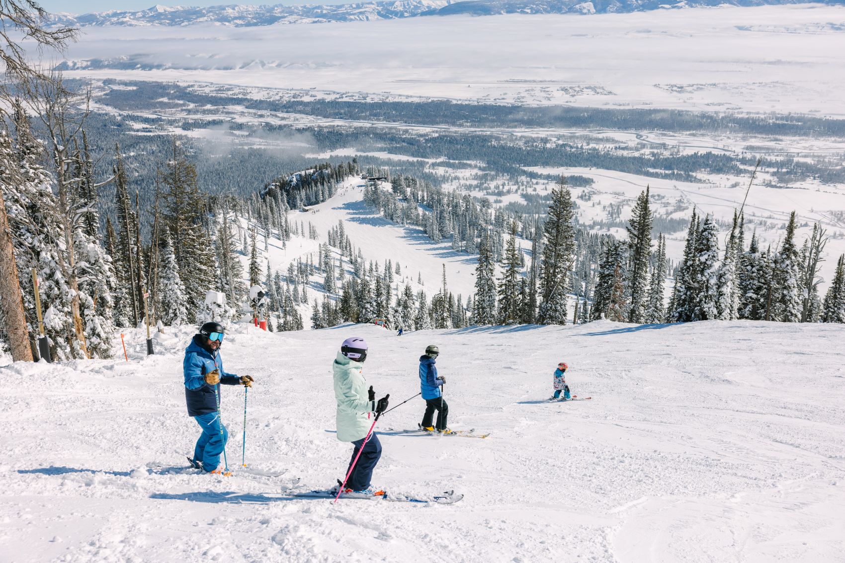 family skiing together