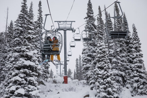 Skiers on the chairlift
