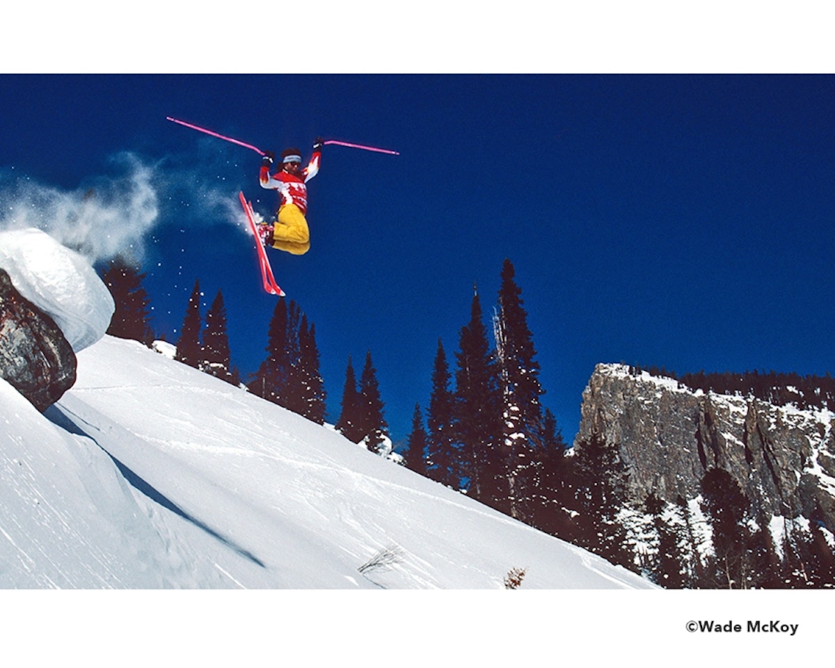 Skier dropping cliff