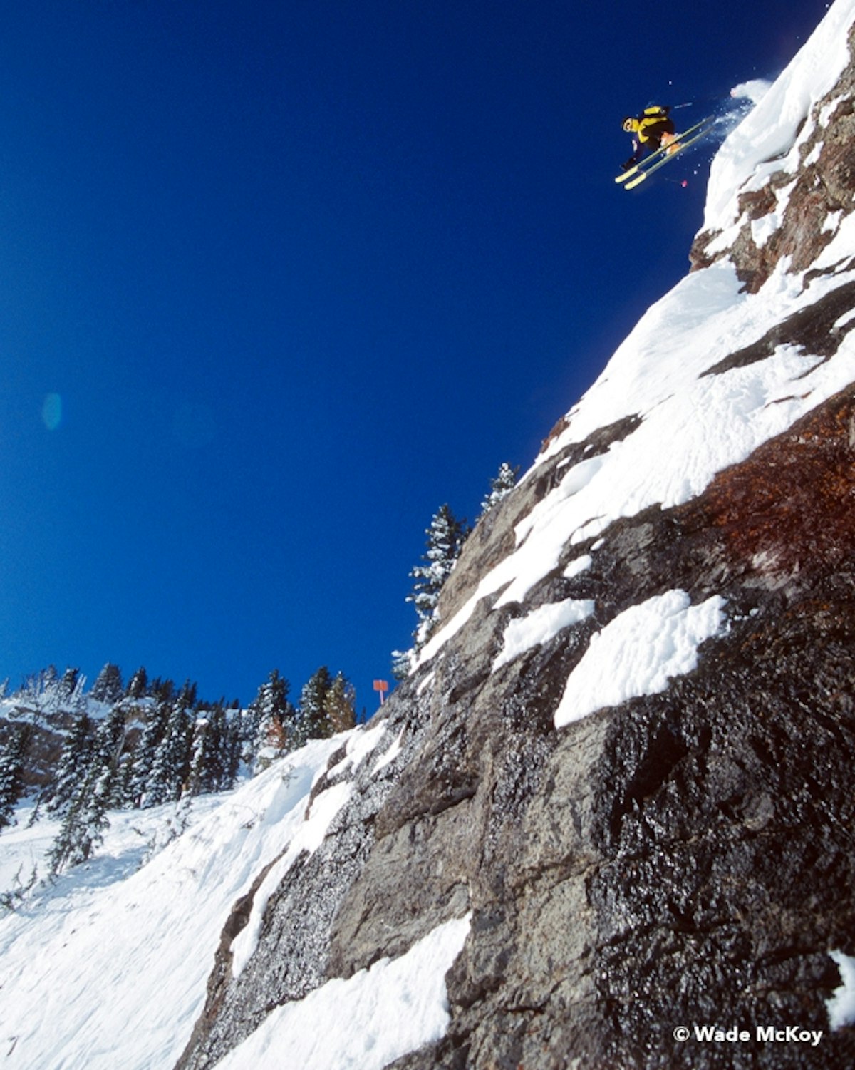 skier dropping cliff