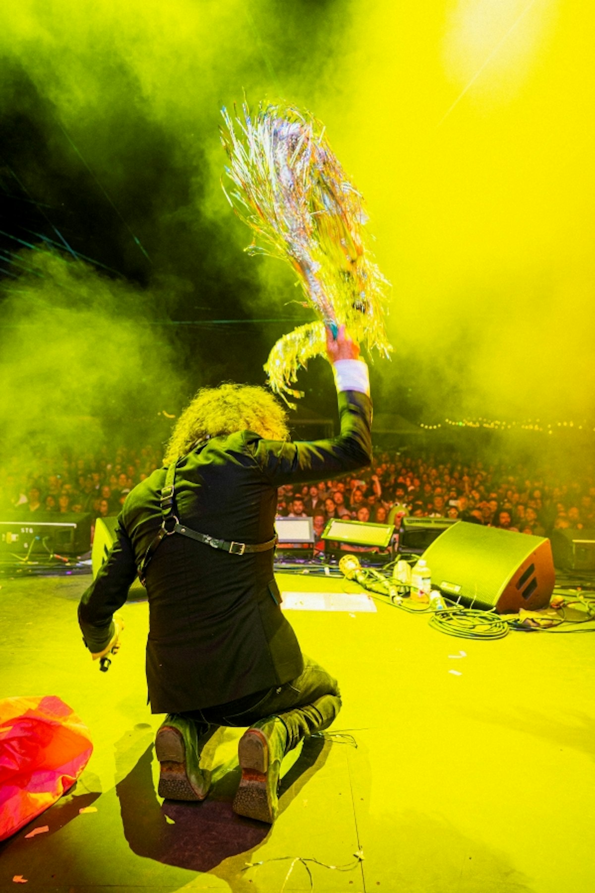 Colorful photo of Flaming Lips lead singer performing